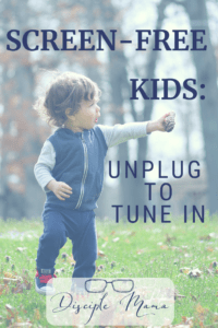 Toddler boy holding a pinecone with text overlay: Screen-Free Kids: Unplug to Tune In