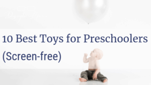baby boy on the floor holding a balloon with text overlay: 10 best toys for preschoolers (screen-free) | Disciple Mama