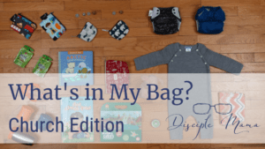 various children's items from church bag on the floor with text overlay: What's in my Bag? Church Edition | Disciple Mama